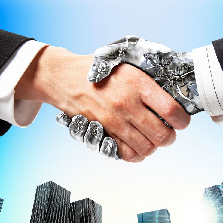 A robot and a human shaking hands, signifying the interplay between artificial intelligence and humans in the world of mergers and acquisitions.